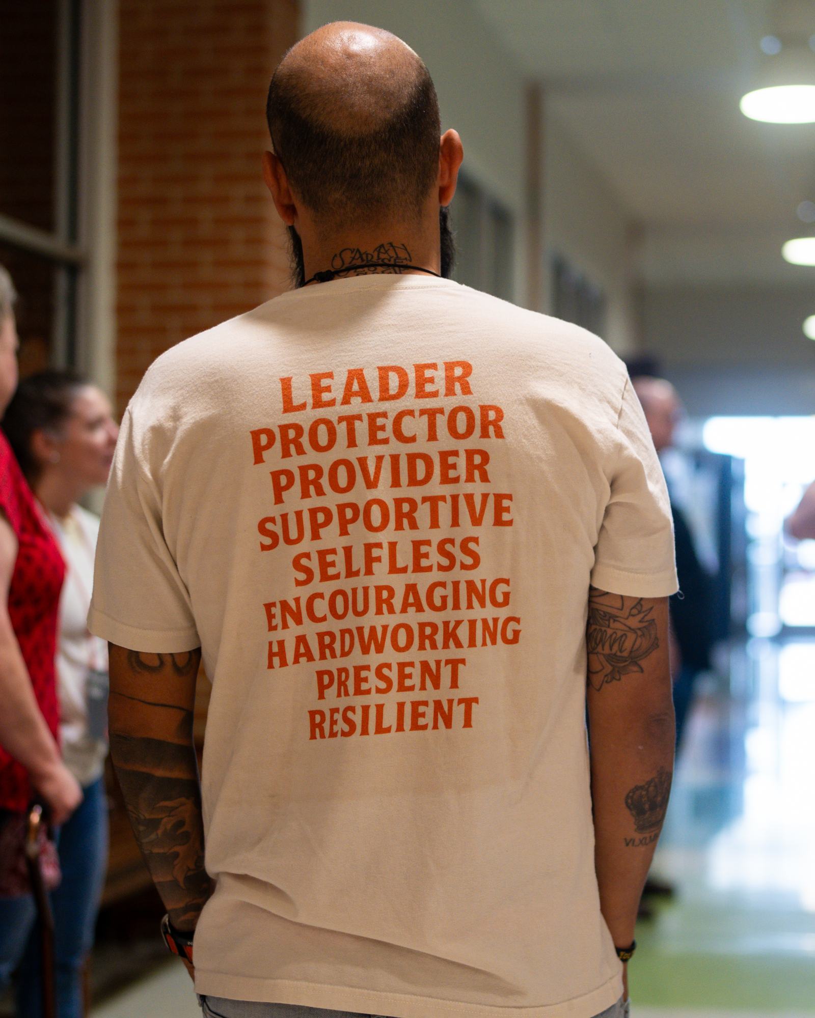 A man standing in the hallway before a service